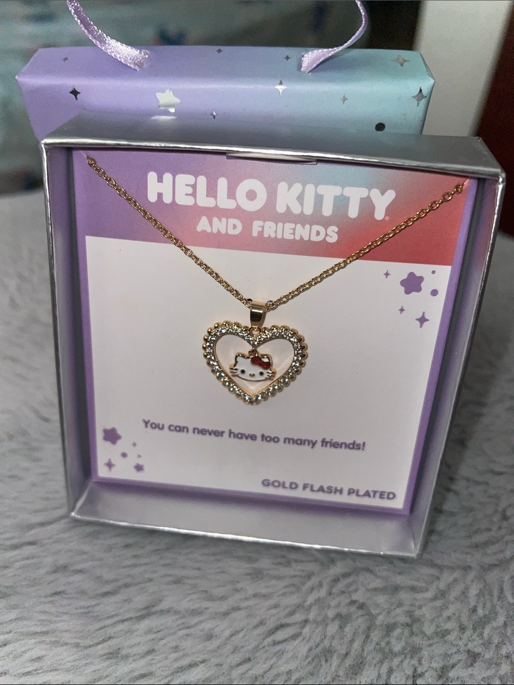 Hello Kitty Gold-Tone Heart Necklace with White Enamel Face and Red Bow